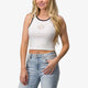 woman in white reef crop top and blue jeans