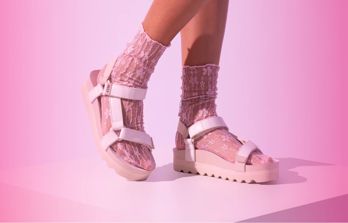 Women in Rem Hi platform sandals with socks on
