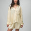 Woman wearing Ellie Button Up light yellow striped shirt facing forward showing front view, comfort-focused casual apparel.