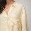 Ellie Button Up showing left shoulder and chest pocket, yellow striped beach-inspired comfortable women's apparel.