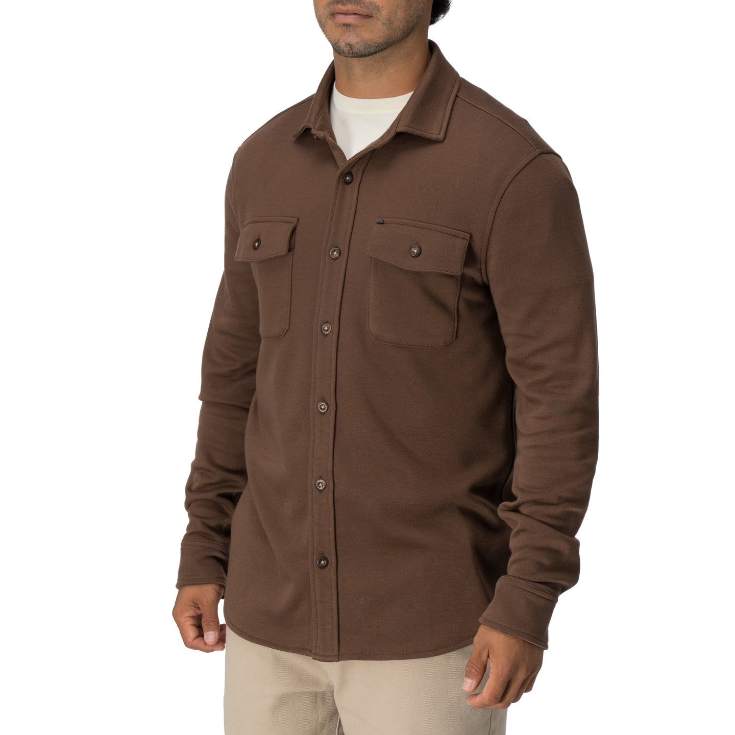 Man wearing brown Coltrane Pique Shirt with front pockets, styled for beach-inspired comfort from StoreRank.ai All Products.