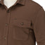 Close-up of the Coltrane Pique Shirt front pocket and upper chest in brown, showcasing its relaxed, comfortable beach-inspired design.