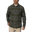 Man wearing a dark green and gray plaid Reggie Flannel Shirt with chest pockets, styled casually for cool weather.
