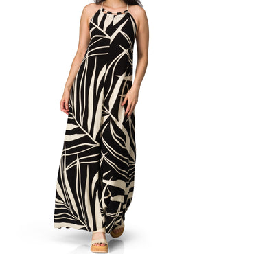 Woman wearing Tori Linen Maxi Dress with black and beige print, front view, styled for beach and active lifestyles.