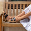 Woman wearing Cushion Vista Higher sandals facing left, close-up of side and sole showing black straps and cushioned platform.