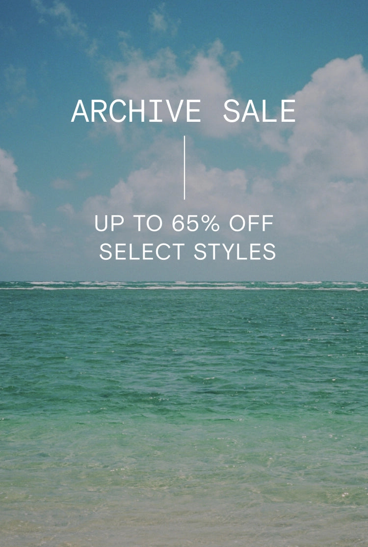 Text Says: "Archive sale, up to 65% off select styles", image of the ocean