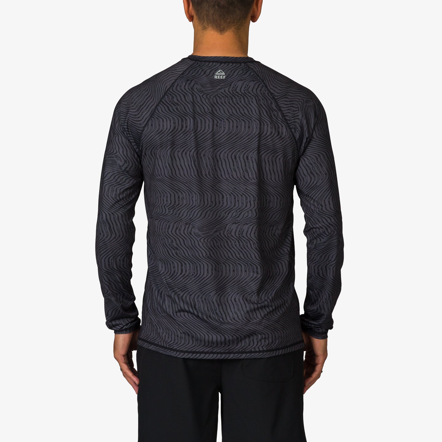 Back view of men's Dune Performance Shirt in dark pattern, lightweight and surf-inspired comfort apparel for active beach lifestyles
