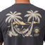 Back view close-up of Siesta Performance Shirt showing hammock skeleton graphic between palm trees on charcoal fabric.