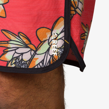 Close-up of Tanner Boardshort hem with floral print and REEF logo, designed for comfort and beach lifestyle.
