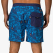 Men wearing blue Felix Boardshort facing backward, showing back pocket with flap, beach-inspired comfort design.