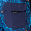 Close-up of the navy pocket with REEF logo on the blue and orange patterned Felix Boardshort for men, facing forward.