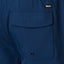 Close-up of the back pocket on the Garland Hybrid Short in navy blue, highlighting the REEF logo and durable stitching.