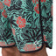 Close-up of the lower right leg of Fayder Boardshort showing vibrant floral pattern and REEF logo facing forward.