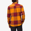 Rear view of a man wearing the Morris Ls Wvn Shirt in orange and red plaid, showcasing comfort-focused, beach-inspired apparel.