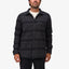 Front view of man wearing Bartlett Woven Jacket with button closure, chest pocket, and striped black fabric, beach-inspired comfort.