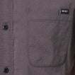 Close-up of the front pocket on the Collins Ss Wvn Shirt in gray with REEF label, designed for comfort and everyday wear.