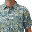 Close-up of the front chest and collar of the men’s Eugene Woven Shirt in a blue and yellow tropical pattern.
