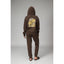 Person wearing brown Misty Fleece Full Zip hoodie back view with floral and rainbow design, paired with comfortable black sandals facing back