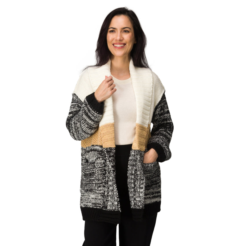 Model wearing the Hazy Sweater Cardigan with chunky yarns, colorblocking, voluminous sleeves, and patch pockets, front view.