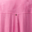 Close-up of pink Ollie Shirt Dress fabric showing textured leaf pattern and small metal logo detail on the back panel.