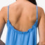 Back view of a woman wearing the blue Lainey Maxi Dress with adjustable straps and ruffled top edge