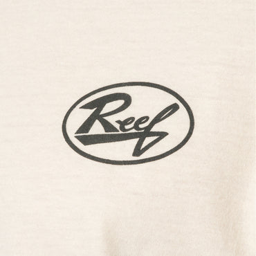 Close-up of cream-colored fabric with black Reef logo print on front of Auto Tee for men