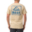 Man wearing beige Xavier Tee showing back with blue REEF logo, surf-inspired comfort apparel for men.