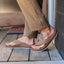 Side view of men's Phantom Bonzer sandals in tan, showing comfortable cushioning and arch support on wooden floor.