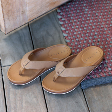 Phantom Bonzer men's tan flip flops facing right, close-up of top with soft-rebound cushioning and arch support.