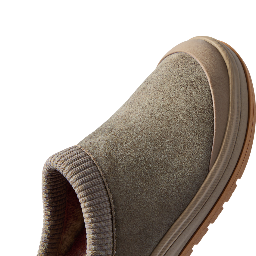 Campfire Lodge clog facing right in close-up, showing its premium suede upper and soft plaid-lined opening