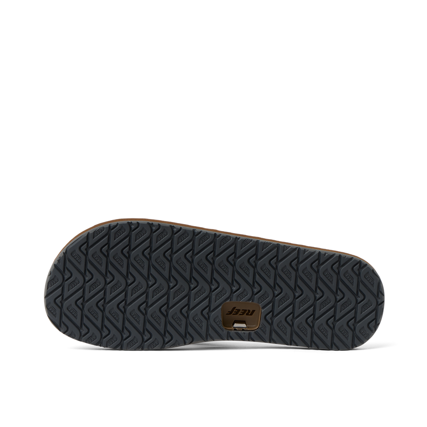 Reef Draftsmen men's sandal outsole facing right with textured traction tread and cushioned footbed sides