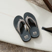 Fanning men’s sandals facing upward, showing top view of cushioned footbeds with anatomical arch support.