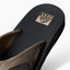 Fanning men's right sandal facing up showing textured footbed with anatomical arch support and cushioned strap