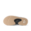 Fanning men's flip flop outsole facing up, brown herringbone tread with black bottle opener and REEF logo for beach comfort