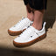 Lay Day Dawn women's white sneakers with gum sole, facing forward, featuring anatomical arch support and cushioning.