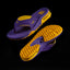 Fanning Pregame men's purple and gold sandal showing top view and bottom tread facing left, surf-inspired comfort design.