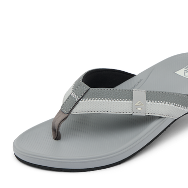 Cushion Phantom 2.0 men’s sandal facing left, close-up of grey soft-rebound cushioned toe strap and footbed.