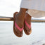 Close-up of feet wearing Reef Cushion Breeze pink sandals facing forward, showcasing soft cushioning and arch support.