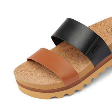 Close-up of Cushion Vista Hi sandal facing right, showing cork footbed and dual black and brown straps for comfort.