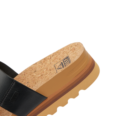 Close-up of the heel and footbed of Cushion Vista Hi facing right, featuring cork, arch support, and soft cushioning.