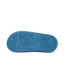 Kids Rio Slide showing the bottom sole facing up with surf-inspired wave and palm tree tread pattern in navy blue rubber