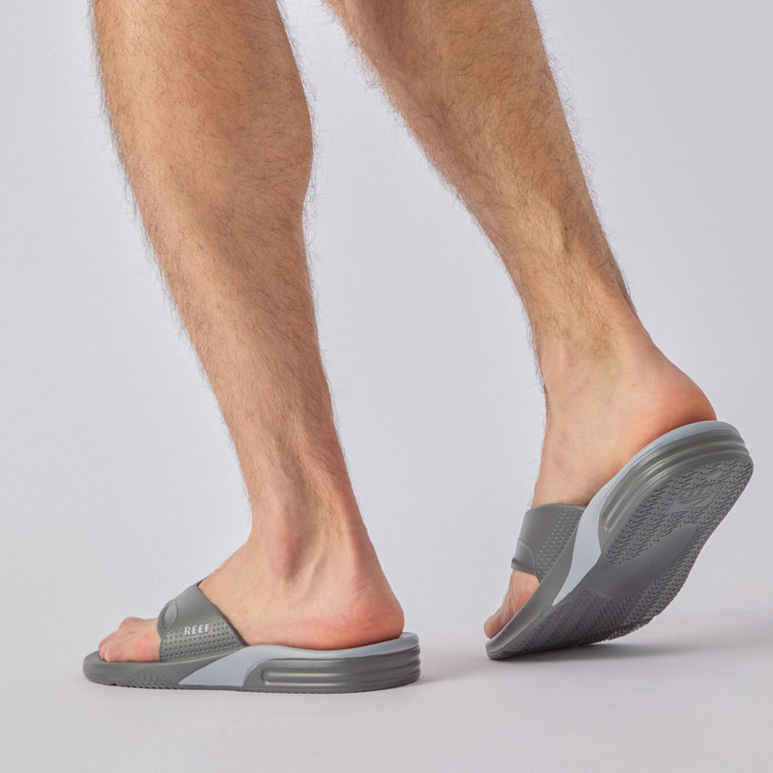 Fanning H2O gray water friendly flip flops facing left with cushioned footbeds and durable textured soles