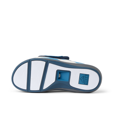 Cruiser Slide men's footwear showing the navy and grey sole facing upward with surf-inspired design and cushioning.