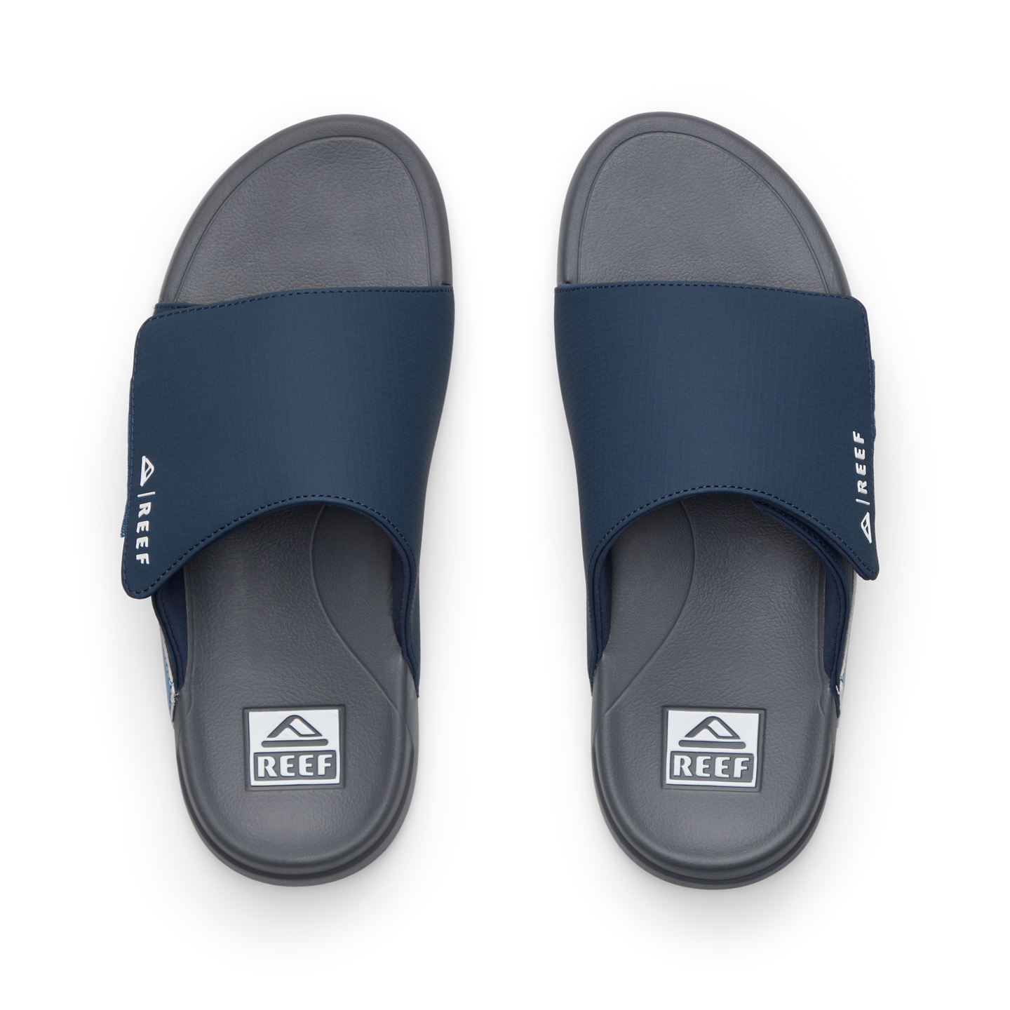 Top view of men's Cruiser Slide navy and grey slides with anatomical arch support and soft cushioning by REEF.