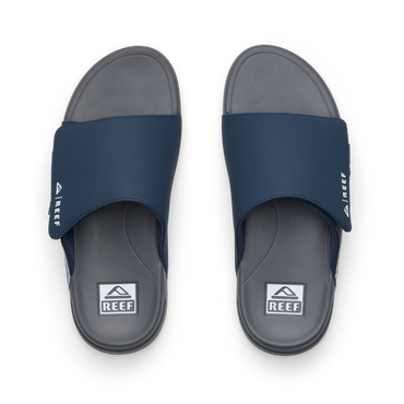 Top view of men's Cruiser Slide navy and grey slides with anatomical arch support and soft cushioning by REEF.