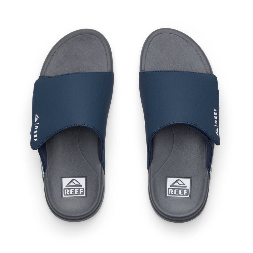 Top view of men's Cruiser Slide navy and grey slides with anatomical arch support and soft cushioning by REEF.