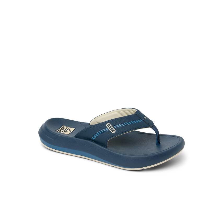 Cruiser men's navy blue flip flop facing left, close-up of top and side with soft cushioning and arch support