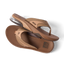 Pair of Fanning + men's brown flip flops shown from side and top, featuring cushioned sole and anatomical arch support