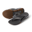 Pair of Fanning + men's black and gum flip flops, showing top view of right and sole of left, with cushioning and arch support.