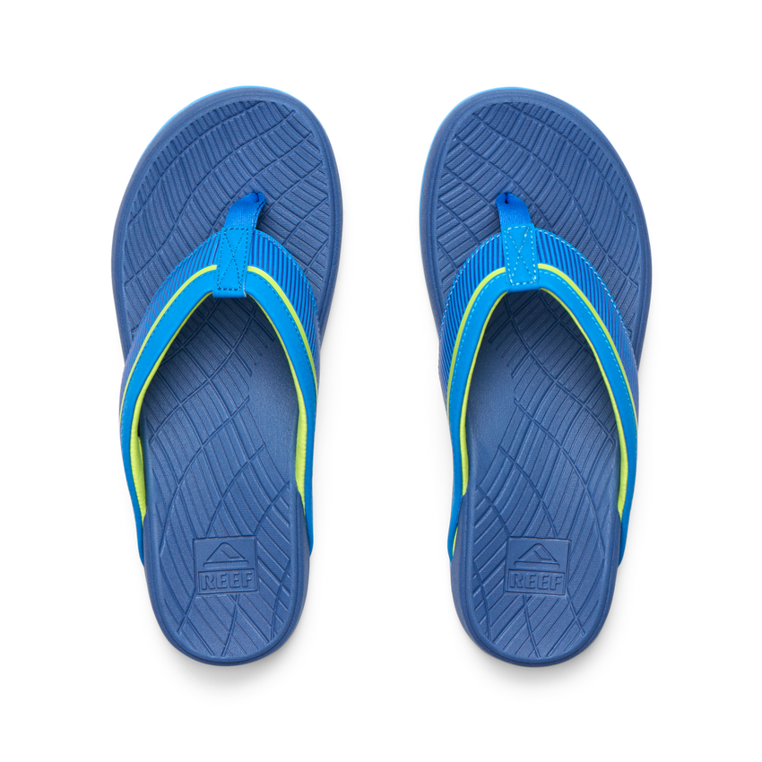 Top view of Kids Windswell blue and volt boys flip flops with anatomical arch support and soft cushioning for beach comfort